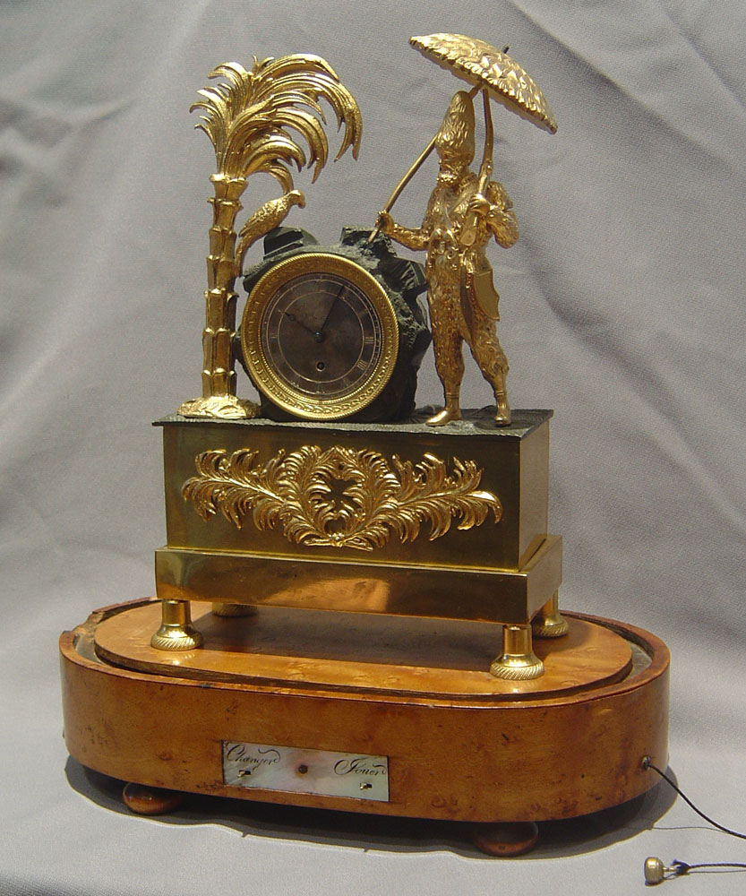 Antique French Robinson Crusoe mantel clock with musical base.