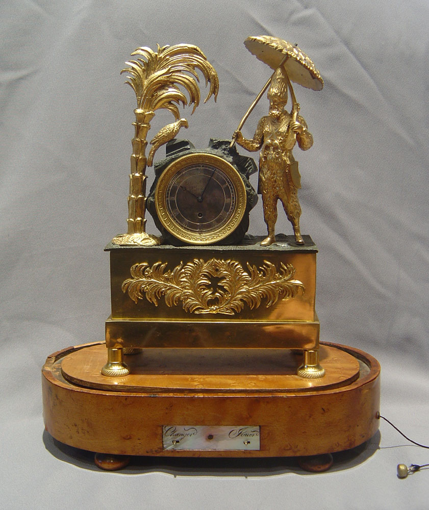 Antique French Robinson Crusoe mantel clock with musical base.