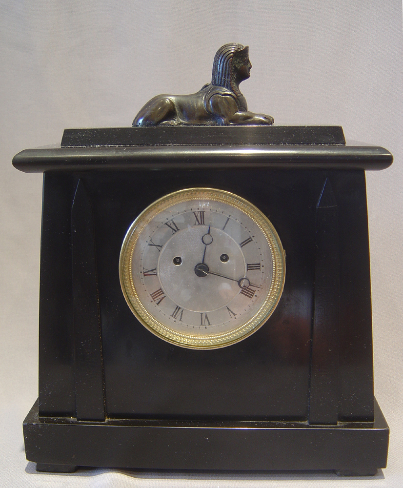 English late Regency Derbyshire black marble double fusee mantle clock in Egyptian style by Yonge.