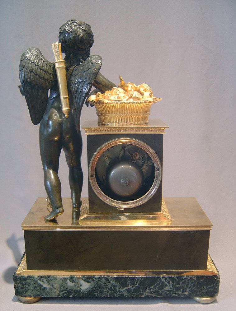 French Empire antique clock by Ledieur in marble, patinated bronze and ormolu.