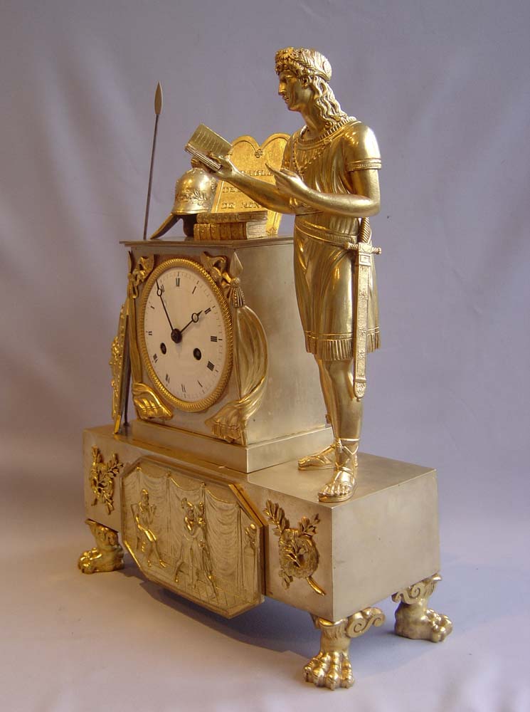 French Empire mantel clock in ormolu of classical figure.