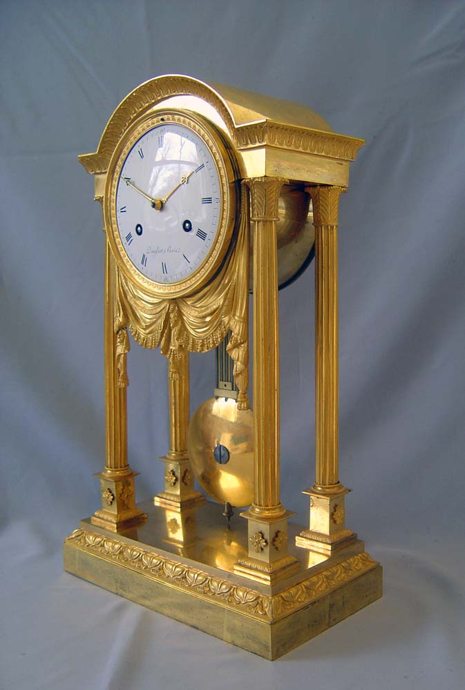 Antique French Empire ormolu mantel clock by Denisart a Paris.