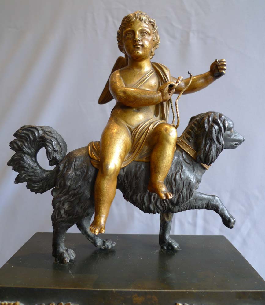 French Directoire or Empire clock with cupid riding a dog.