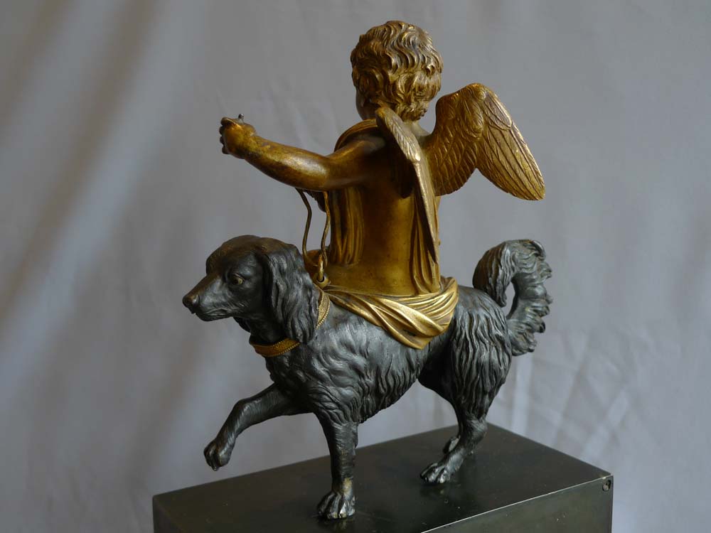 French Directoire or Empire clock with cupid riding a dog.