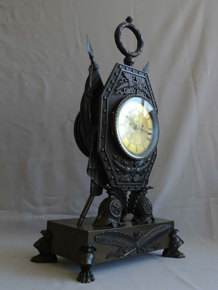 Antique clock in form of Trophies of War English Regency by Forrester of Hull.