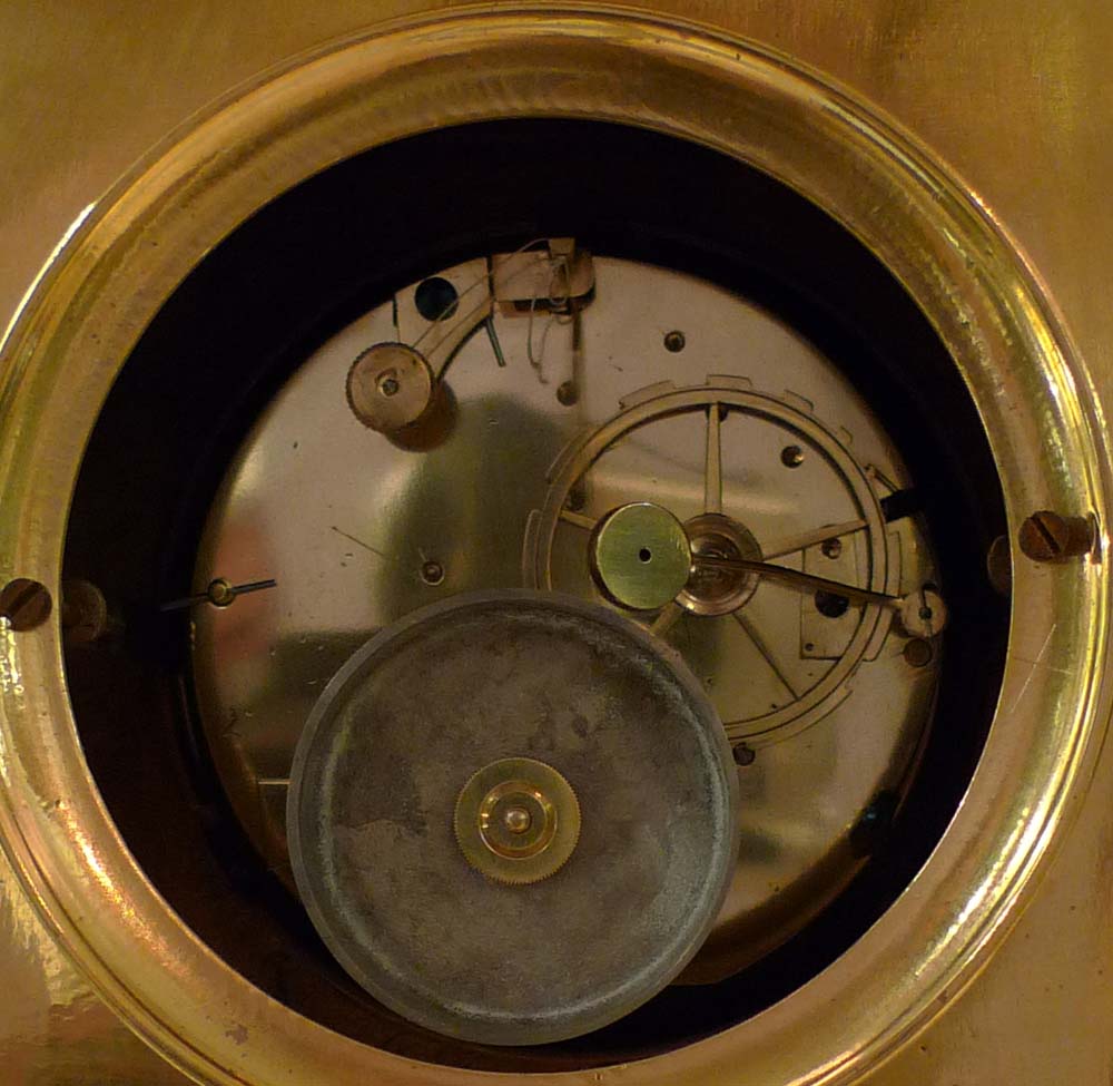 Antique Empire clock in ormolu signed Bergmiller and having military Trophies.