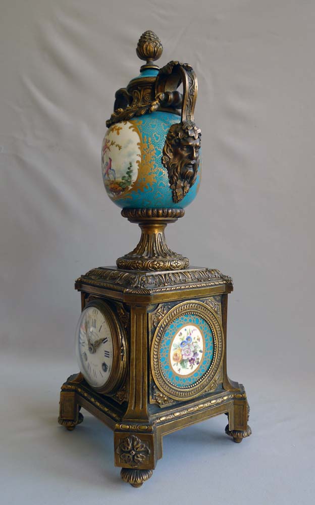 Antique urn clock of porcelain and ormolu signed Balthazar.