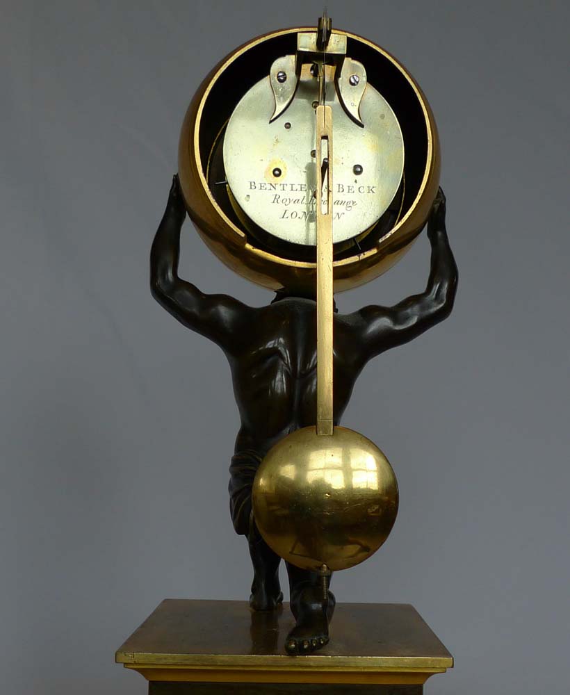 English Regency antique mantel clock,  Atlas holding the world signed Bentley and lBeck 1292.
