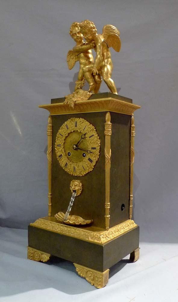 Antique French double automaton clock with two children fighting over a butterfly & water feature.