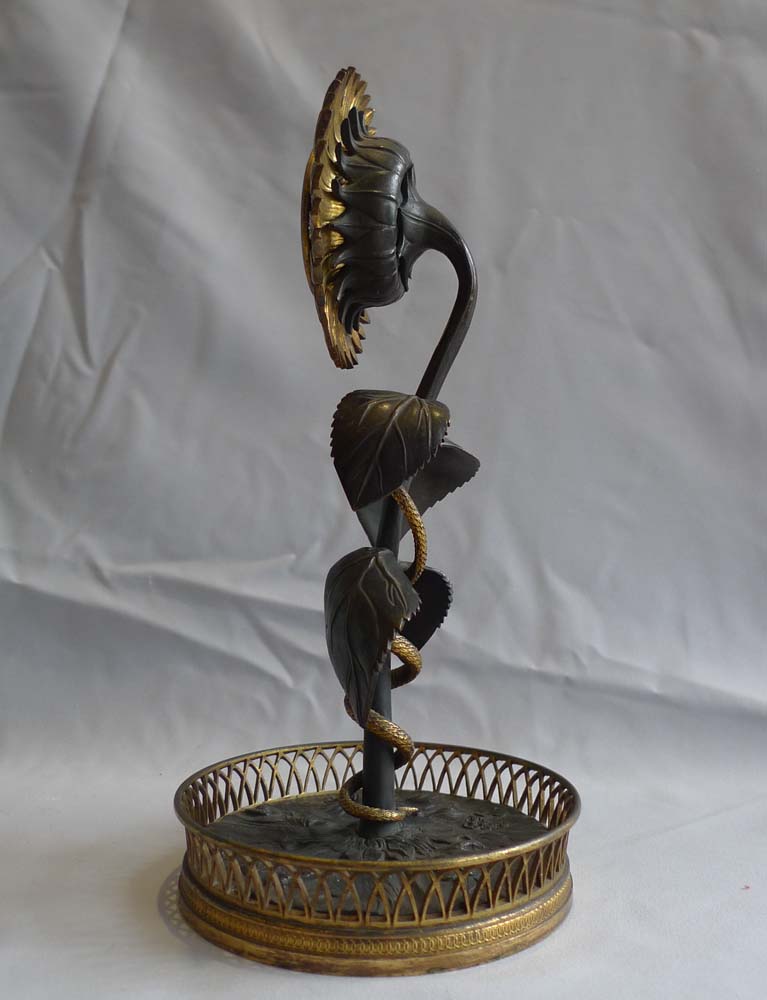 French Empire patinated bronze and ormolu Sunflower clock