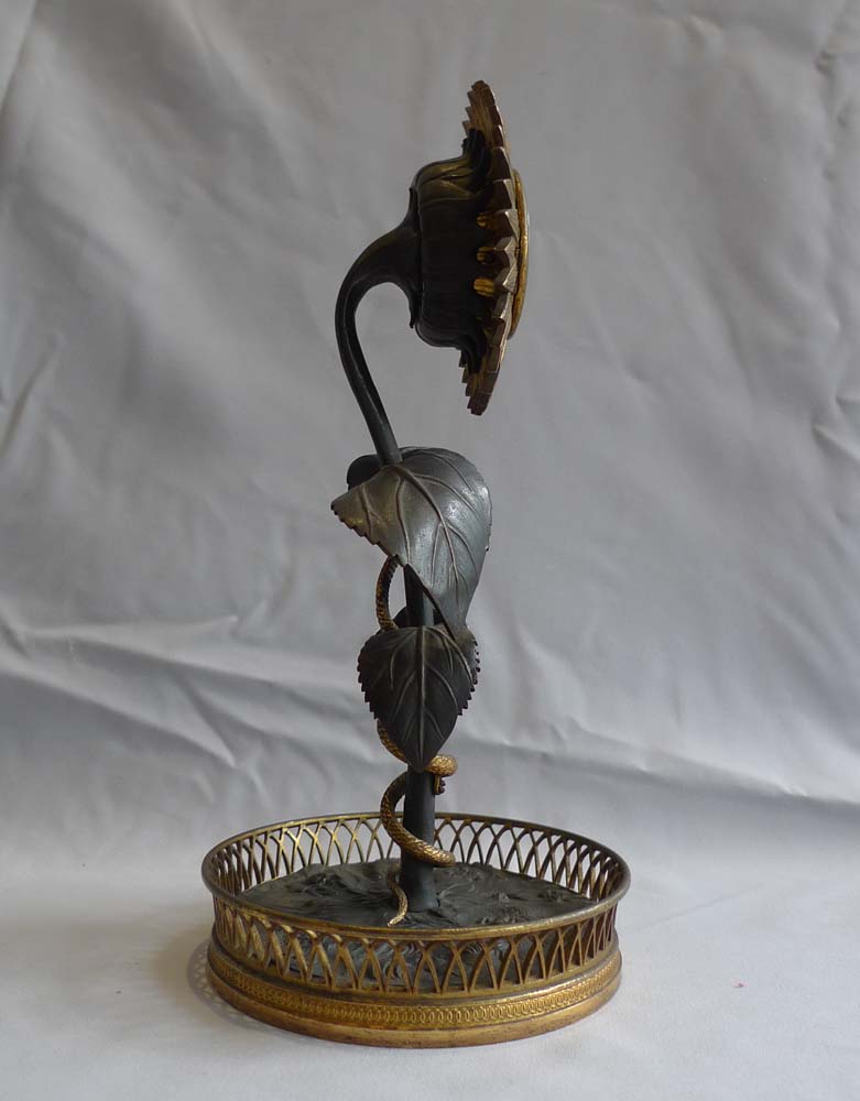 French Empire patinated bronze and ormolu Sunflower clock