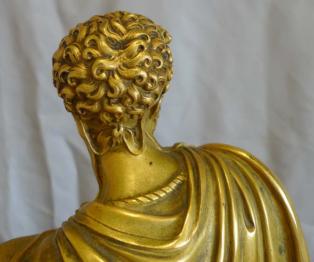 Antique French mantel clock Charles X  of Marcus Aurelius in ormolu and patinated bronze.