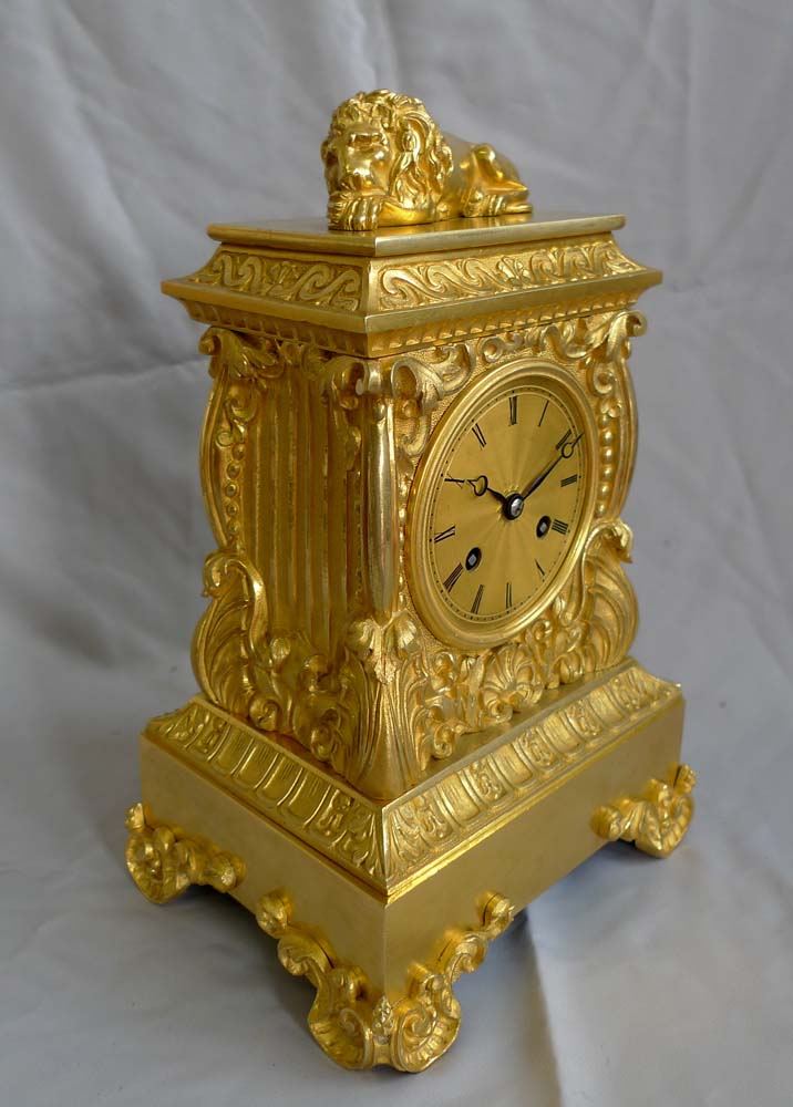 Antique ormolu French mantel clock surmounted by Lion.