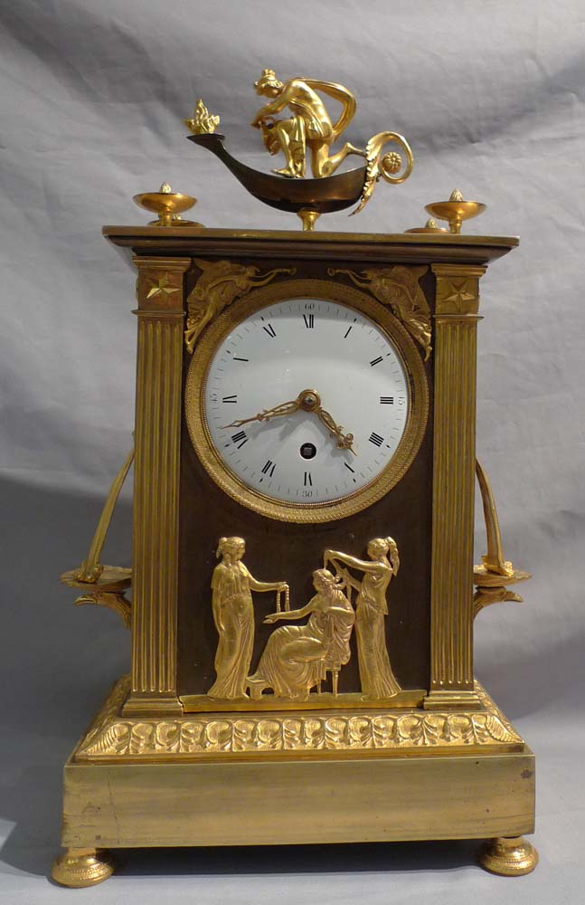 French Empire ormolu antique mantel clock of neo-classical design.