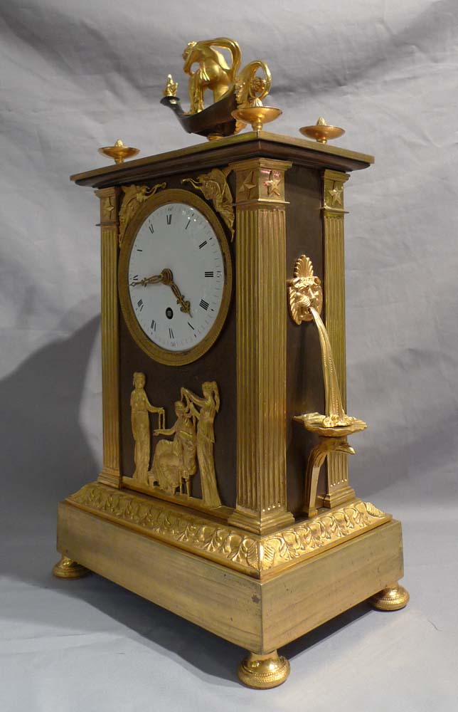 French Empire ormolu antique mantel clock of neo-classical design.