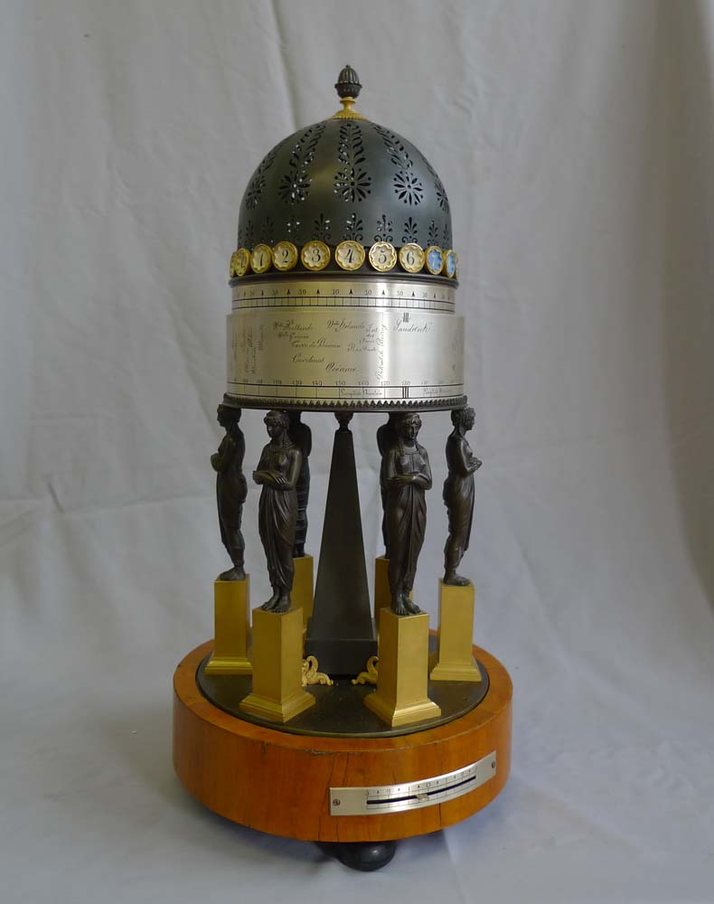 French Empire rotating world time clock in gout d'Egypt temple form.