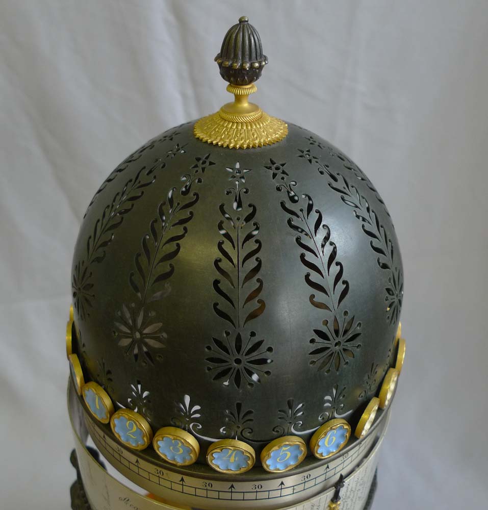 French Empire rotating world time clock in gout d'Egypt temple form.