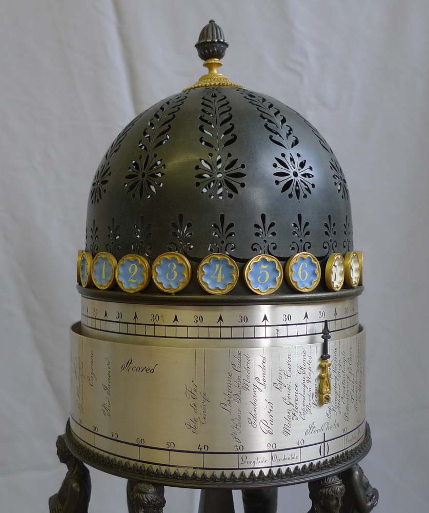 French Empire rotating world time clock in gout d'Egypt temple form.