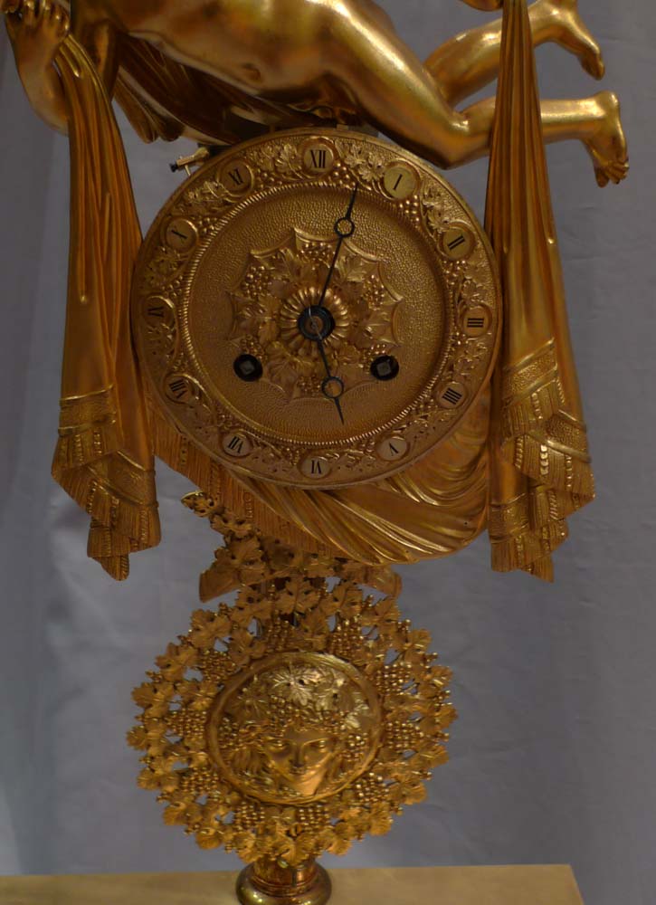 Antique French 19th century mantel clock of Cupid floating over clouds.