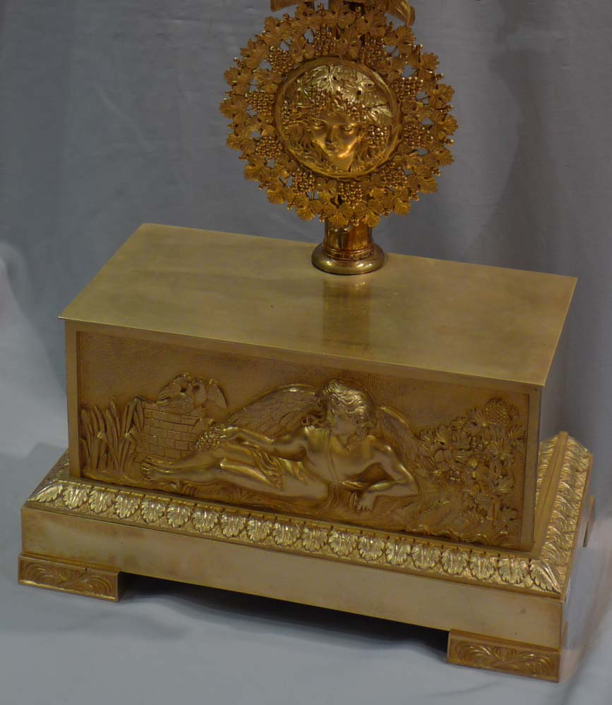 Antique French 19th century mantel clock of Cupid floating over clouds.