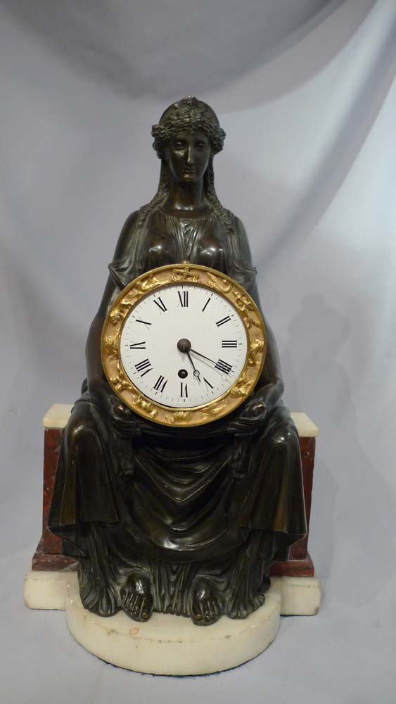 Antique English Regency mantel clock of Cybele sitting on her throne.