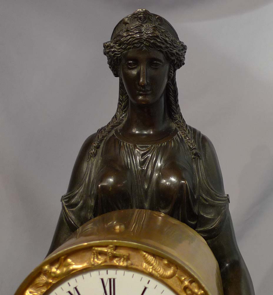 Antique English Regency mantel clock of Cybele sitting on her throne.