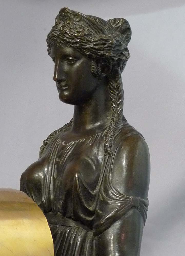 Antique English Regency mantel clock of Cybele sitting on her throne.