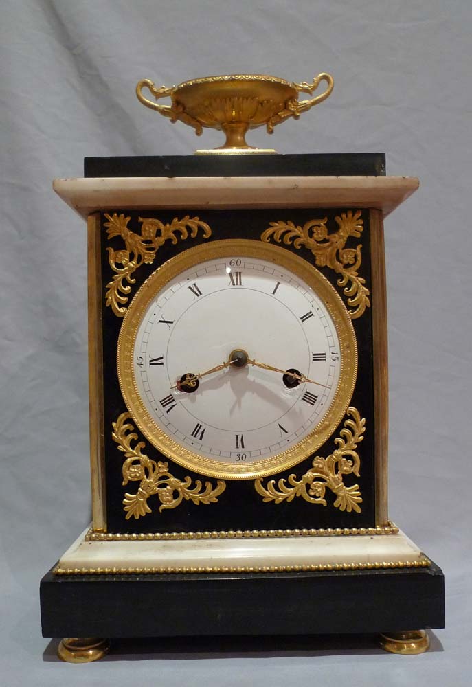 Antique French Directoire marble and ormolu mantel clock.