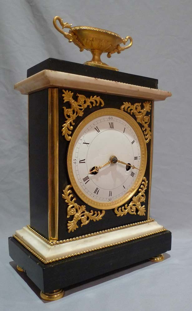 Antique French Directoire marble and ormolu mantel clock.
