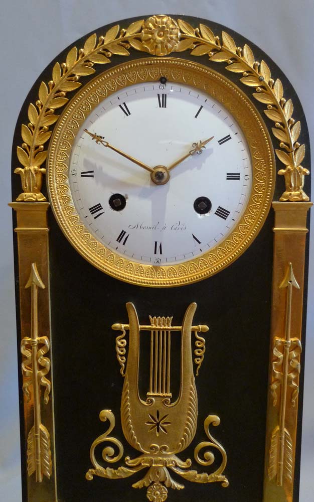 French Empire antique mantel clock in ormolu, patinated bronze and marble signed Mesnil.