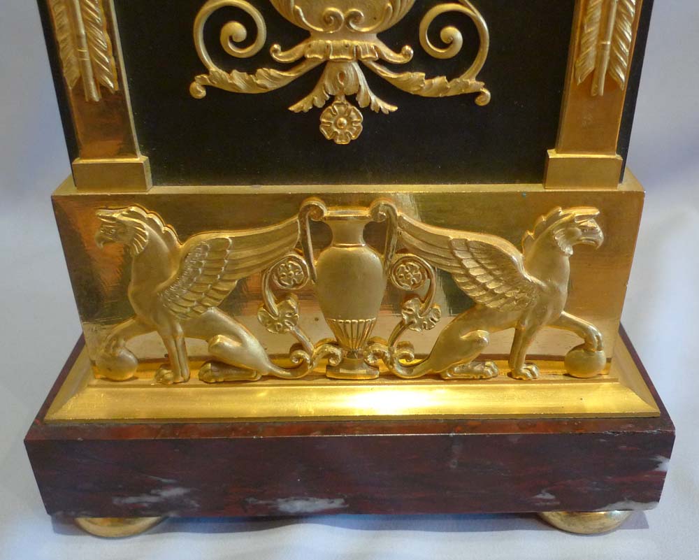 French Empire antique mantel clock in ormolu, patinated bronze and marble signed Mesnil.