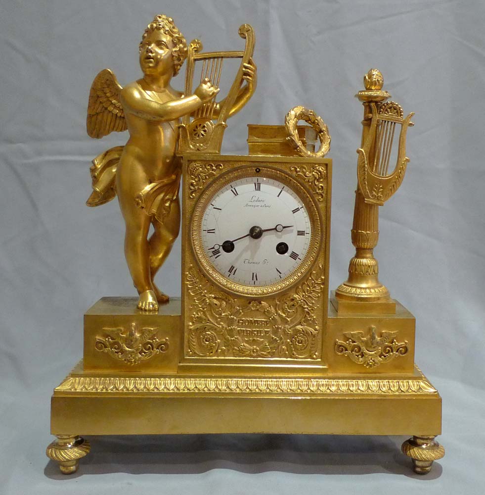 Antique French Empire clock of cupid playing harp signed Ledure bronzier & Thomas hr.