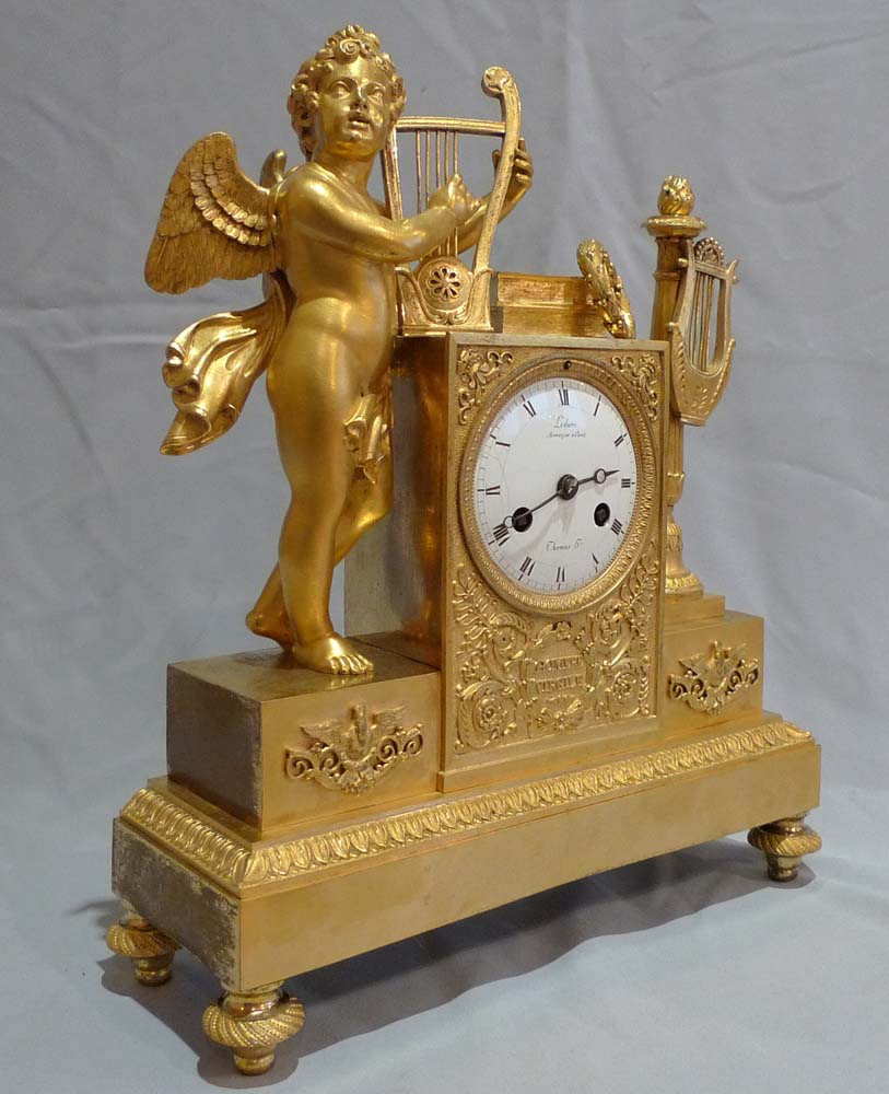 Antique French Empire clock of cupid playing harp signed Ledure bronzier & Thomas hr.