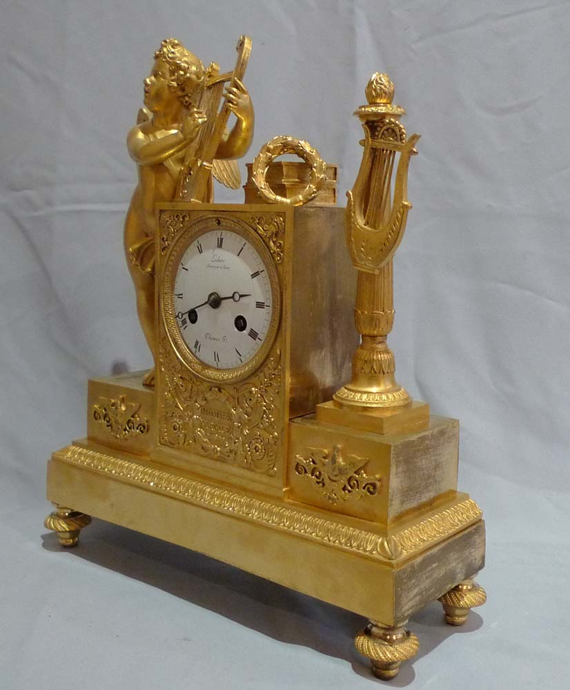 Antique French Empire clock of cupid playing harp signed Ledure bronzier & Thomas hr.