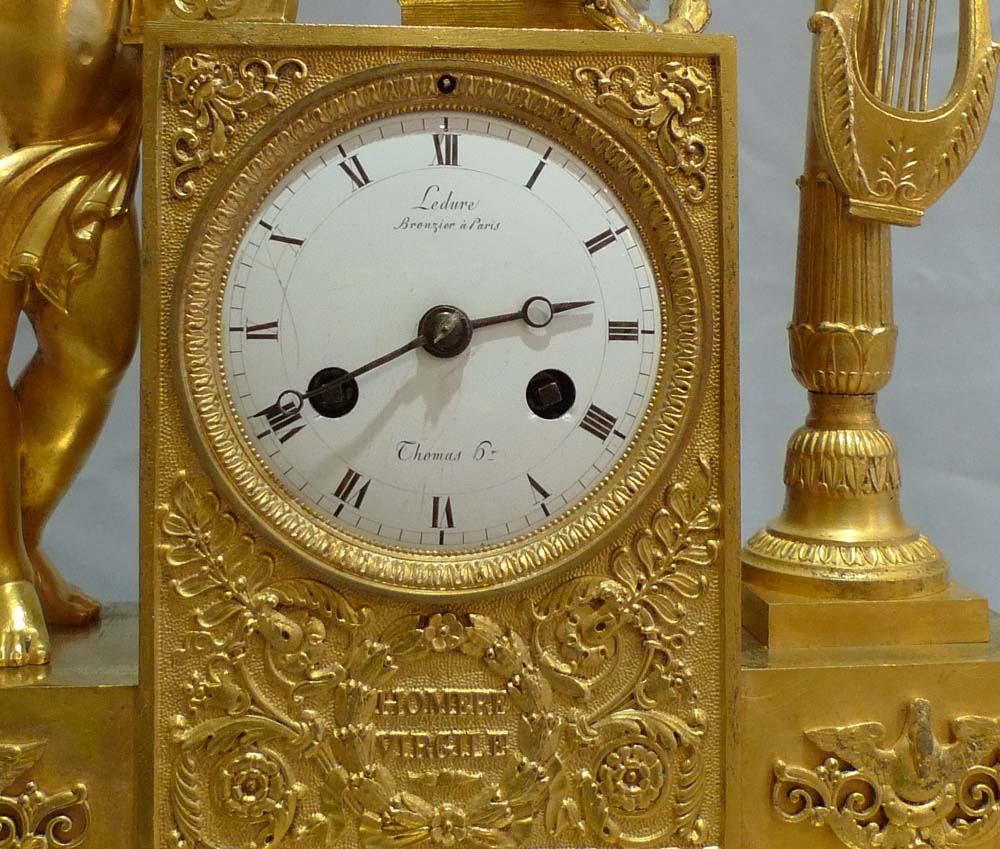 Antique French Empire clock of cupid playing harp signed Ledure bronzier & Thomas hr.