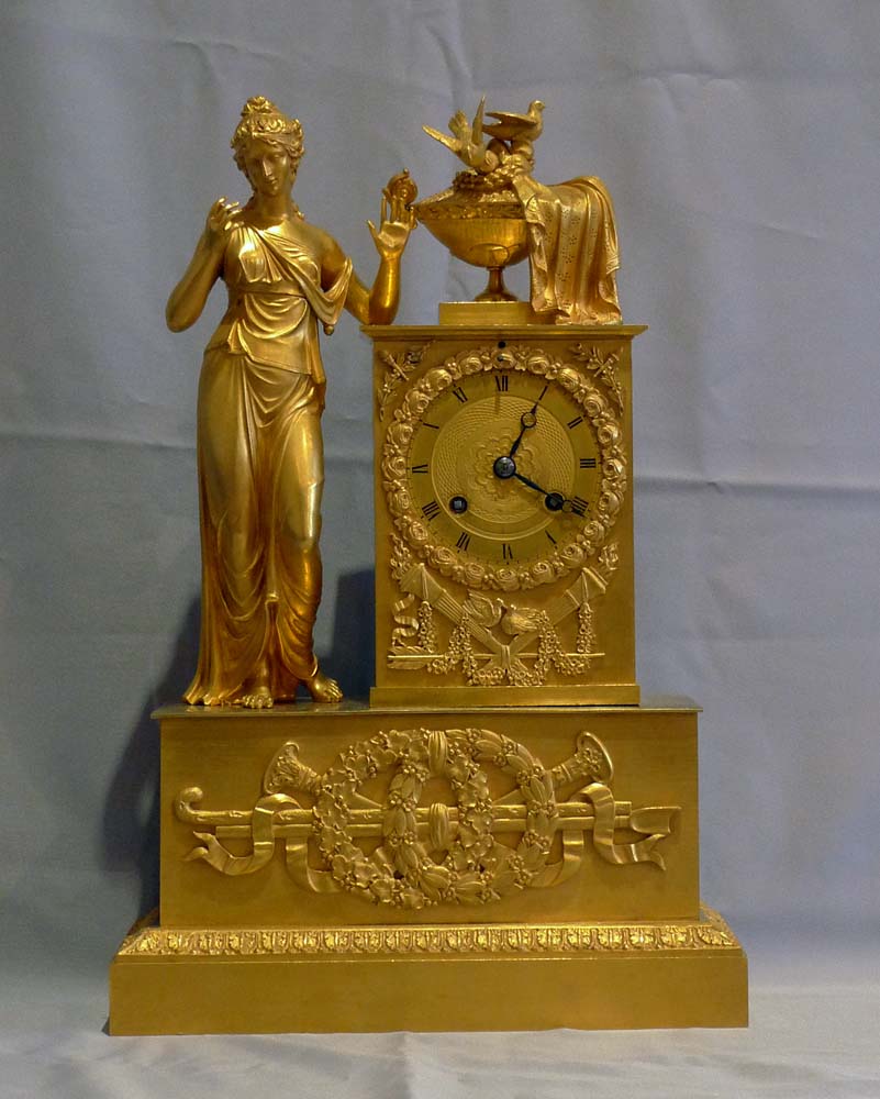 Antique French Empire clock of woman standing.