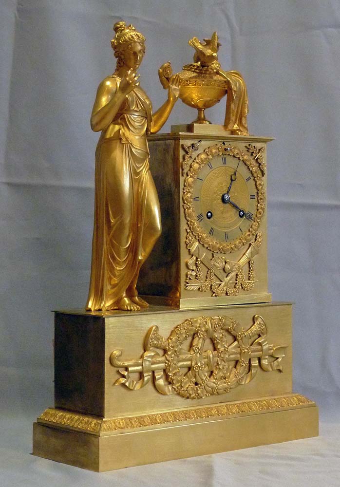 Antique French Empire clock of woman standing.