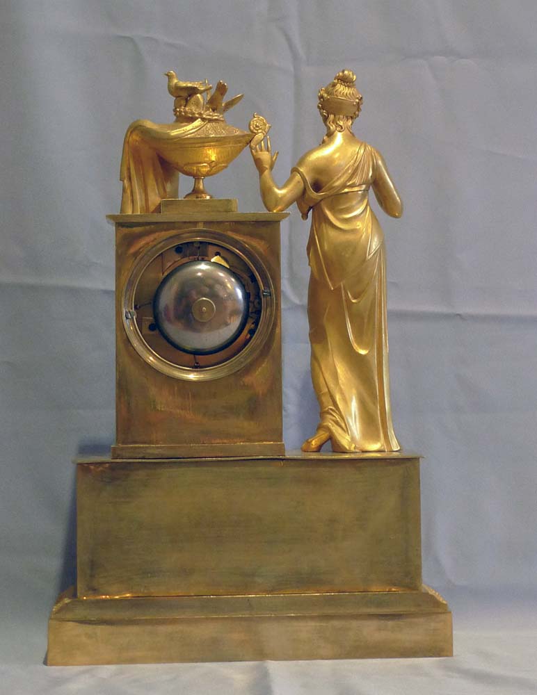 Antique French Empire clock of woman standing.