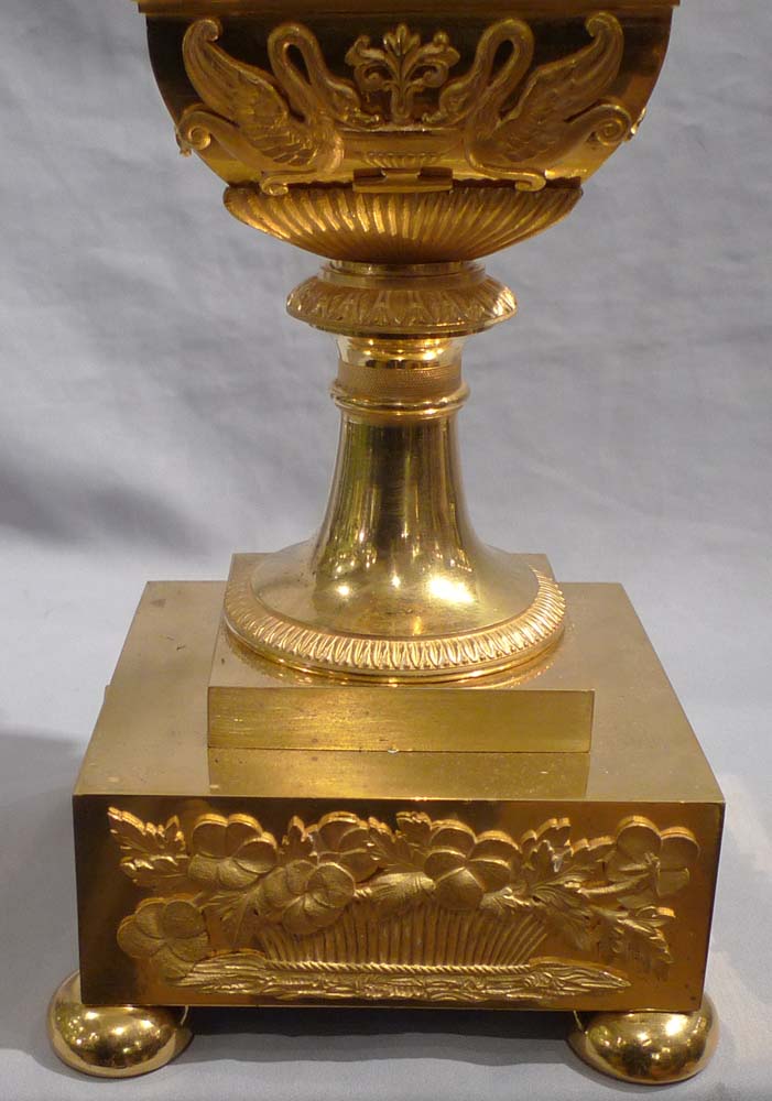 Antique French Empire vase shaped mantel clock in ormolu and patinated bronze