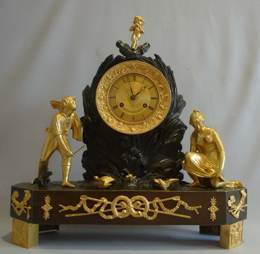 Antique French Charles X ormolu and patinated bronze Arcadian genre mantel clock.