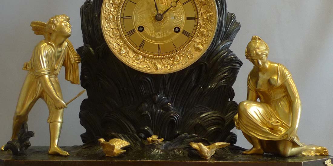 Antique French Charles X ormolu and patinated bronze Arcadian genre mantel clock.