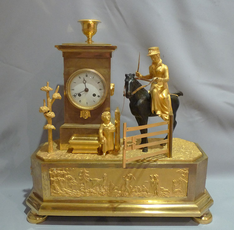 Antique French Empire Genre mantel clock of an Arcadian hunting scene.