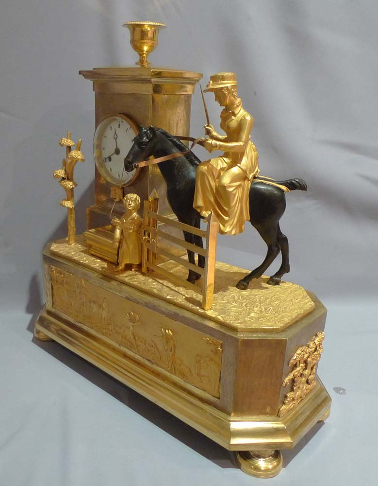 Antique French Empire Genre mantel clock of an Arcadian hunting scene.