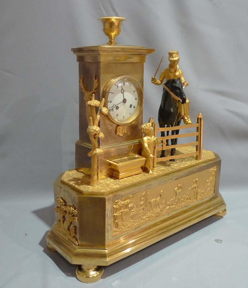 Antique French Empire Genre mantel clock of an Arcadian hunting scene.