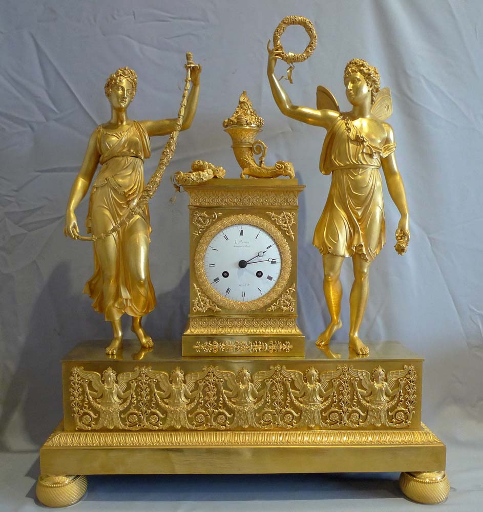 Antique French Empire clock of Psyche and Cupid signed by L.Ravrio bronzier a Paris and Mesnil Hr.