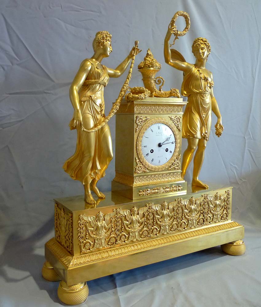 Antique French Empire clock of Psyche and Cupid signed by L.Ravrio bronzier a Paris and Mesnil Hr.