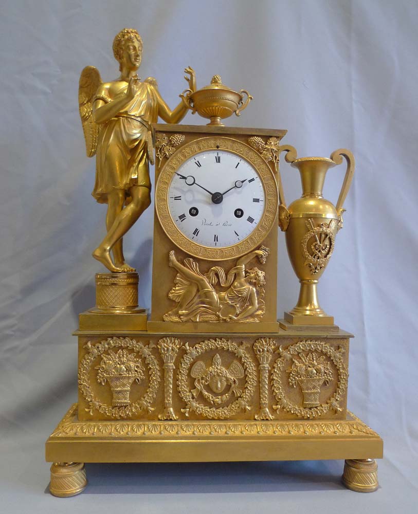 Antique ormolu French Empire clock celebrating viticulture with Cupid and signed Viret a Paris.