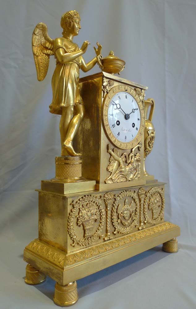 Antique ormolu French Empire clock celebrating viticulture with Cupid and signed Viret a Paris.