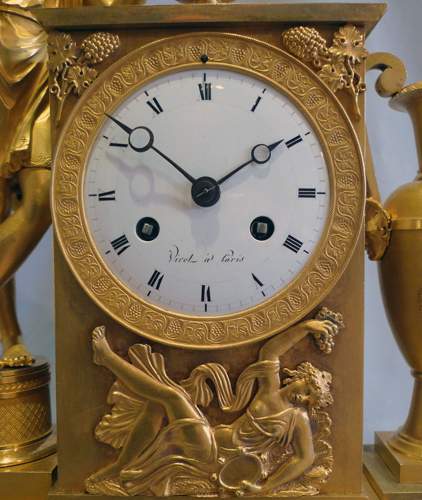 Antique ormolu French Empire clock celebrating viticulture with Cupid and signed Viret a Paris.