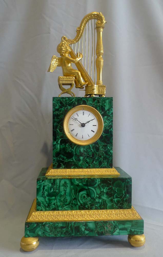 Antique Russian malachite and gilt bronze mantel clock.